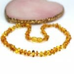 vaikiški gintaro karoliai