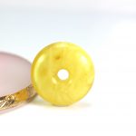 Big natural Baltic amber stone donut amulet